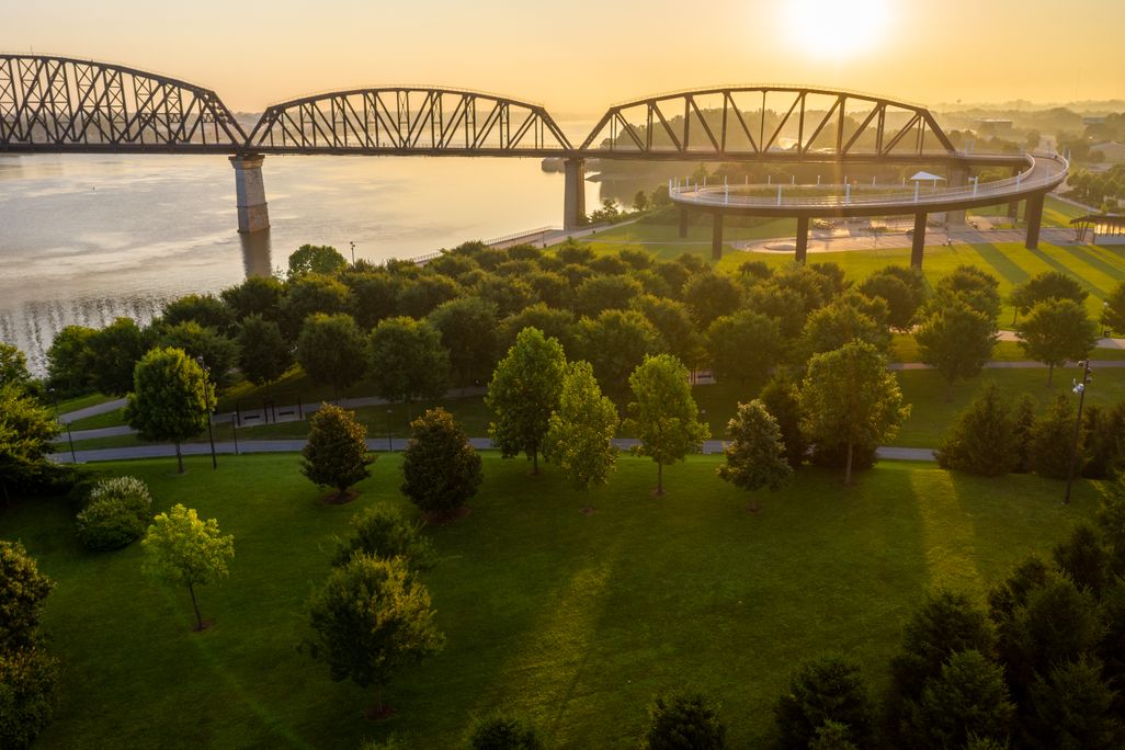 Bridge crossing a river at sunset