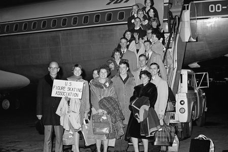 Members of the U. S. figure skating team pose before boarding a Belgian Sabena airline plane at New York's Idlewild Airport on February 14, 1961. The plane crashed on February 15 near Brussels Airport, killing all on board.