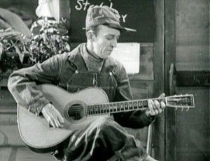 Jimmie Rodgers sings “Waiting for a Train” in The Singing Brakeman.