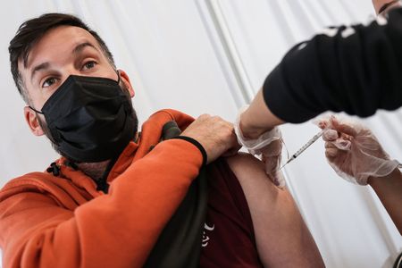 A booster shot is administered in Stony Brook, New York in November. Such a shot can help spur a person&rsquo;s immune system to ramp up defenses against Covid-19.