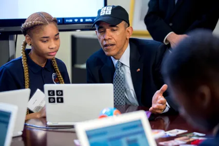 U.S. President Barack Obama participates in an "Hour of Code" event with middle-school students including Adrianna Mitchell in the Eisenhower Executive Office Building next to the White House in Washington, D.C.