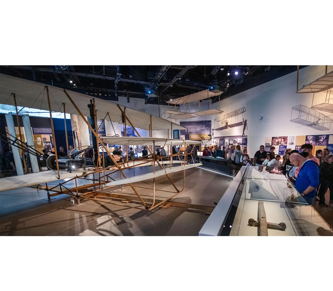 Visitors with the Wright Flyer