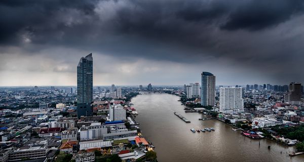 During the rainy season, the river currents are so strong that cargo barges being towed upriver require a team of 5 (five) Tugboats to navigate the Chao Praya River in Bangkok thumbnail