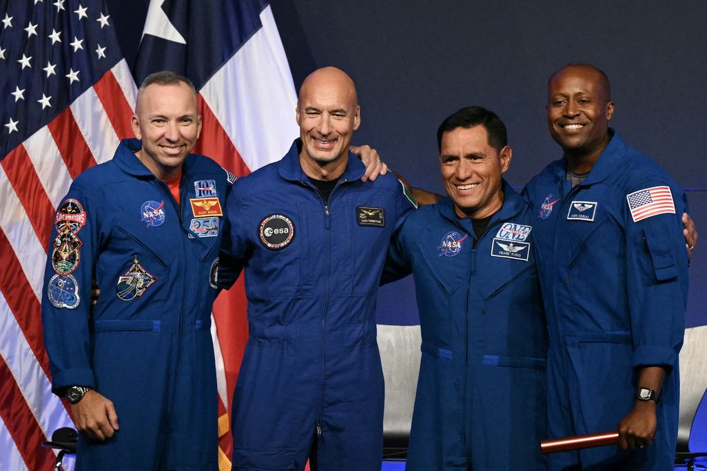 the crew of Artemis iii stands together and smiles at a news conference