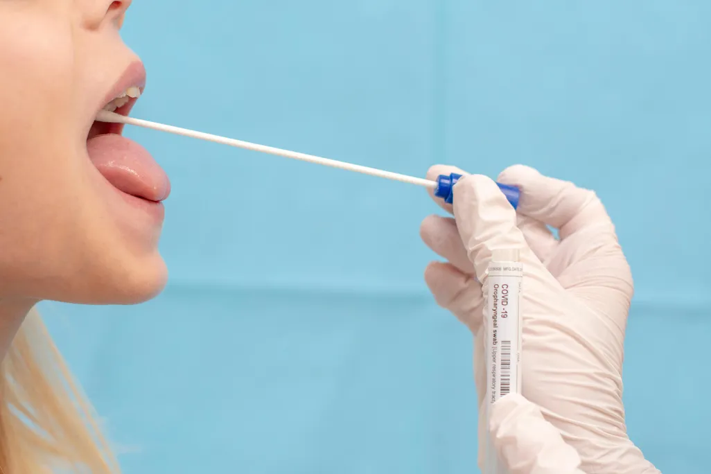 A child is tested for COVID-19