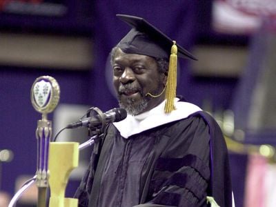 In 2003, Pulitzer-prize winning reporter Les Payne is pictured delivering the traditional charge to University of Connecticut undergraduates during commencement exercises at The Harry A. Gampel Pavilion.