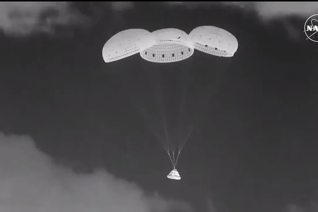 Calypso Starliner capsule with parachutes