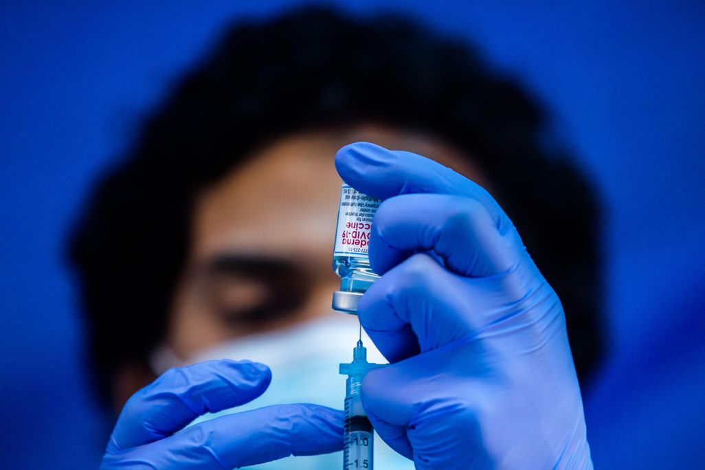 A medical worker loads a syringe with the Moderna Covid-19 vaccine to be administered at a vaccination site in Los Angeles, California