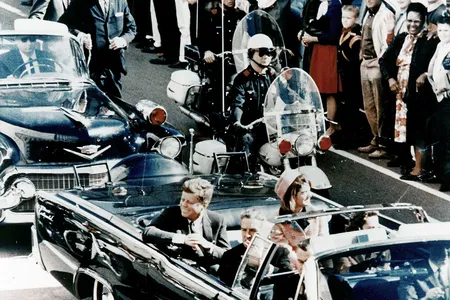 President John F. Kennedy in the presidential limousine before his assassination, on November 22, 1963, with his wife Jacqueline next to him.