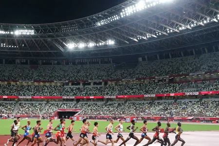 Olympic runners compete during the 10,000 meters race in Tokyo. In ancient times, running was likely used to push animals to exhaustion during hunting.