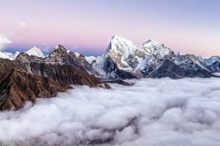 Just before sunset, the peaks of Gokyo Ri in Sagarmatha National Park peek through the clouds.