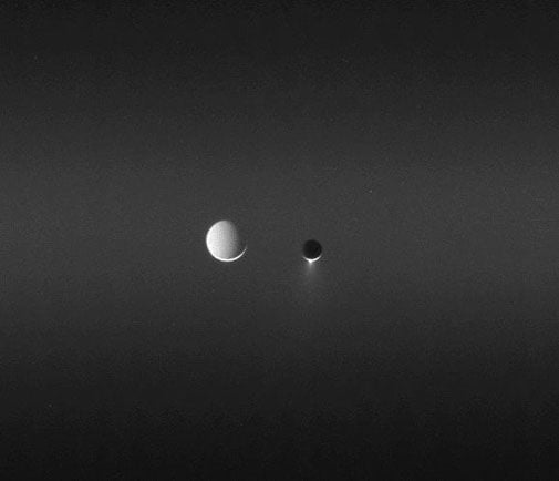 Two of Saturn's satellites, side by side.