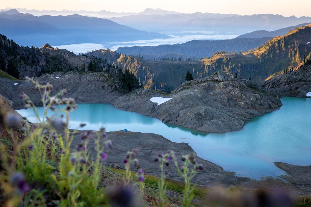 Recreating in vast wilderness areas is an immense privilege of American culture, and the Pacific Northwest is an ideal location for the experience. Here, a small blue tent is dwarfed by the sheer size of the surrounding landscape. When alone in the backcountry, the noise of every day life is lost. Sitting against the backdrop of 50 shades of blue, one has the unique opportunity to be lulled to sleep by trickling streams, tucked into sleep by gentle alpine breezes, and awoken by pink alpenglow reflecting off glaciated peaks.

Containing more than 50-miles of hiking trails, Mount Baker Wilderness in Washington state is a pristine example of America's preserved natural landscapes.
