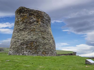A tourist visits Mousa Broch, the tallest known Iron Age broch and one of Europe's best-preserved prehistoric buildings