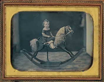 In 1855 (the year of this daguerreotype), rocking horses symbolized middle-class affluence. Today, hand-carved horses are largely for the wealthy.
