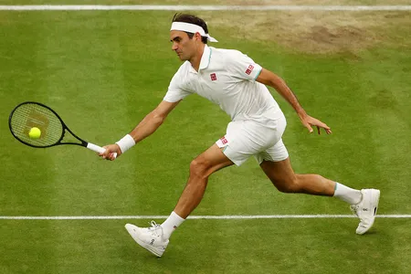 Roger Federer hits a forehand shot at Wimbledon. The tennis great has called his racket an extension of his arm.