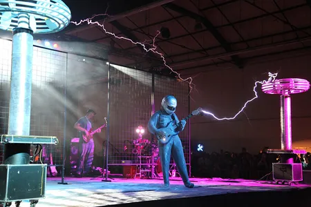 ArcAttack's lightning guitarist wears a protective Faraday suit.