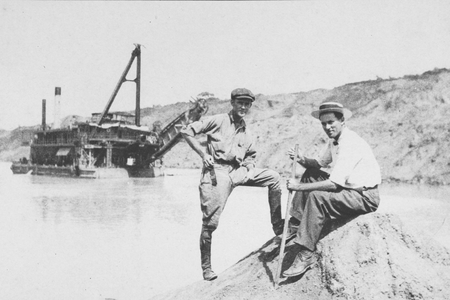 Two canal workers pose in the cut