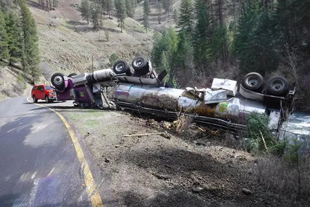 Fortunately, the driver suffered only minor injuries when a tanker truck of salmon rolled onto its roof in Oregon.