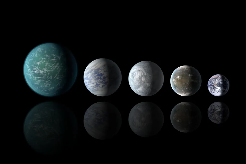 Artists illustrations of the previously known Kepler 22b, and the new 69c, 62e and 62f line up next to Earth.
