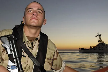 In the Persian Gulf, authorities are concerned about terrorism as well as piracy. Coalition vessels (the Coast Guard cutter Aquidneck, behind Coast Guardsman Zachary Coone) patrol exclusion zones around Iraq's Al Basrah and Khawr Al Amaya terminals, where tankers take on millions of barrels of oil daily.