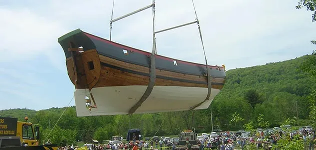 The Onrust being placed in the Hudson River