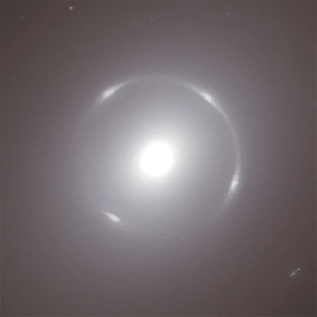 a glowing orb surrounded by a thin white ring