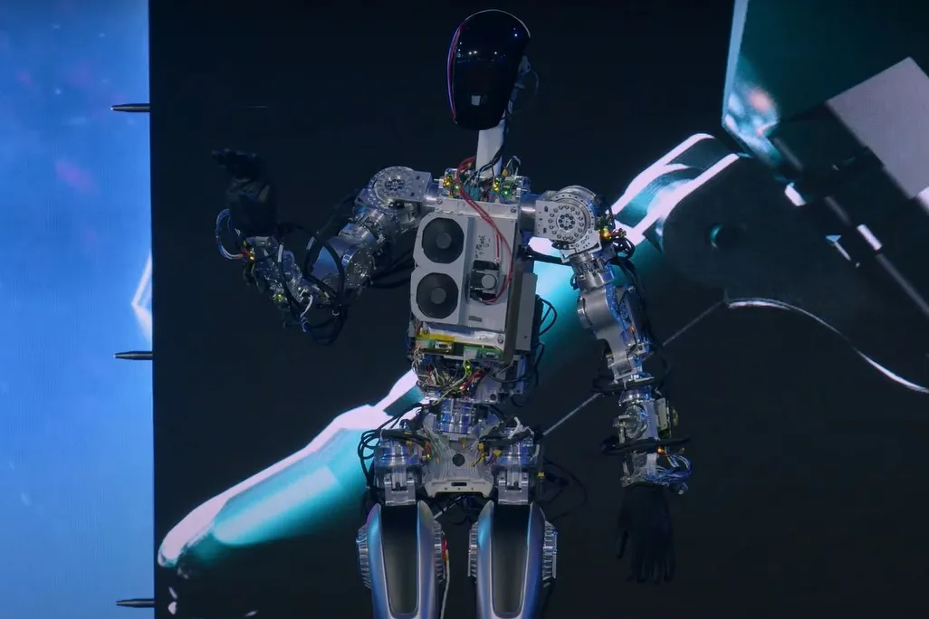 A robot stands on stage