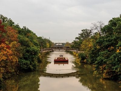 A boat makes a morning trip through the Erie Canal in Rochester, New York, October 2021.