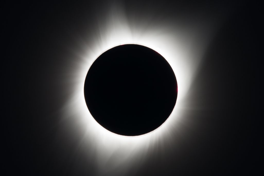 Black circle with a ring of light around it