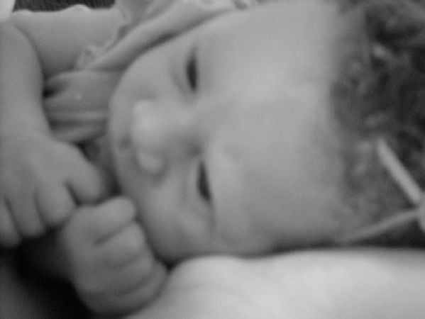 Baby opens her eyes to the strange world around her. thumbnail