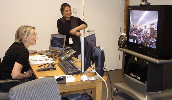 Volunteer Helen Dickerson (L) and staff member Colleen Brown (R) connected with students for virtual lessons from 2004-2011; Photo by SAAM staff.