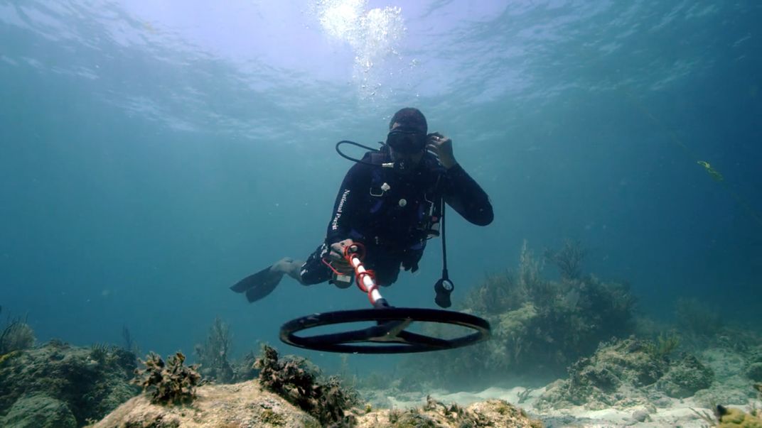 Diver Kramer Wimberley uses a metal detector to search for wreckage from the Guerrero and Nimble off the Florida Keys.