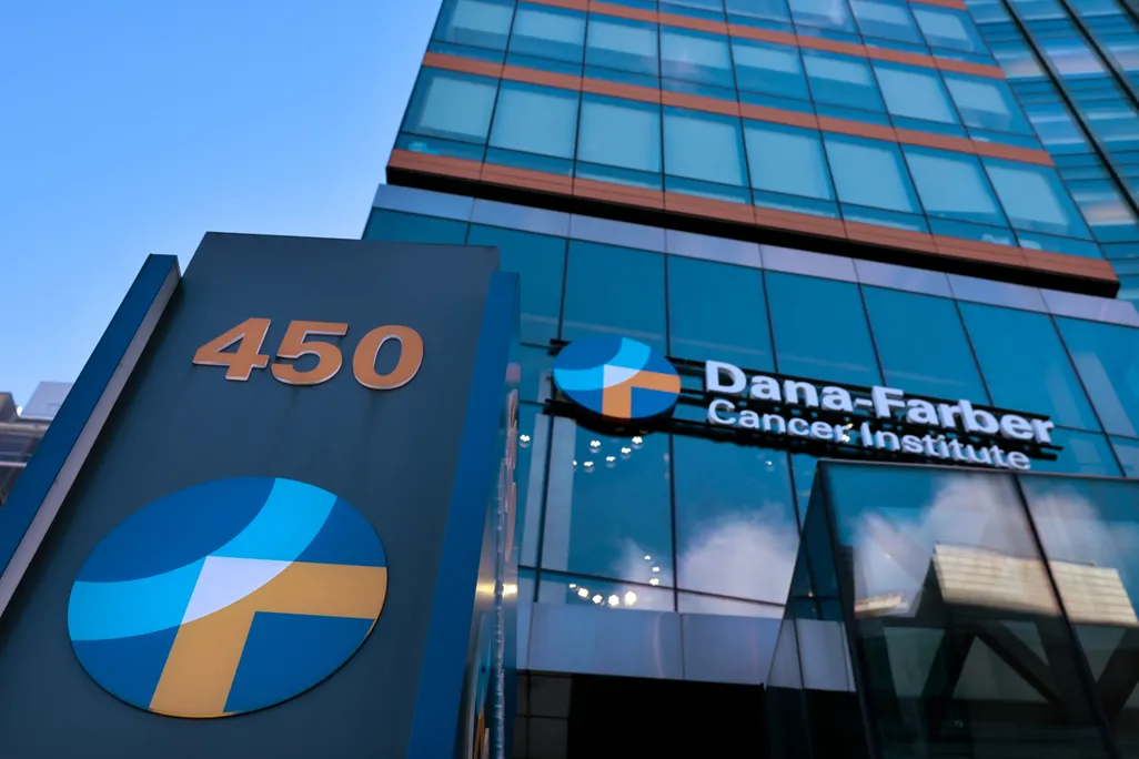 the glass facade of a building marked Dana-Farber Cancer Institute