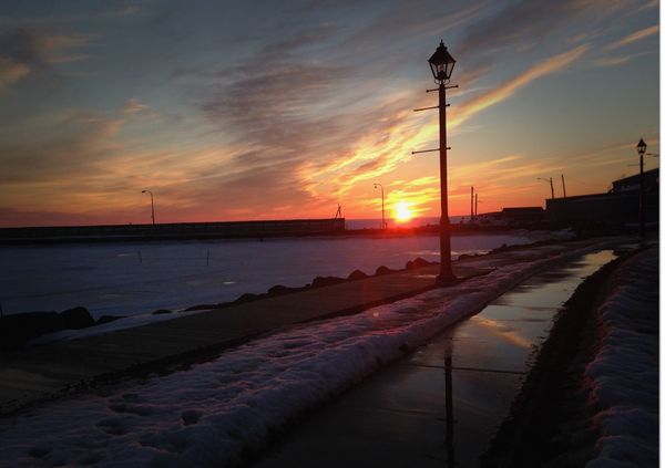 Sunset near the harbour with the boardwalk and   Streetlamp silhouette thumbnail