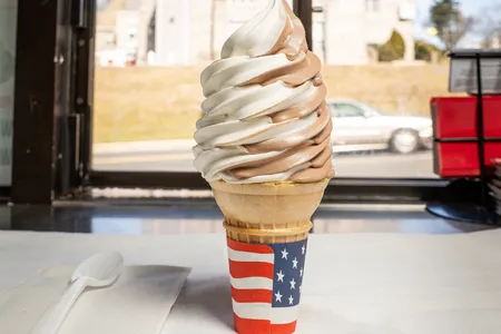 Who needs a spoon to enjoy this perfectly swirled chocolate-and-vanilla soft-serve ice cream served on a cone? Put the formalities aside.