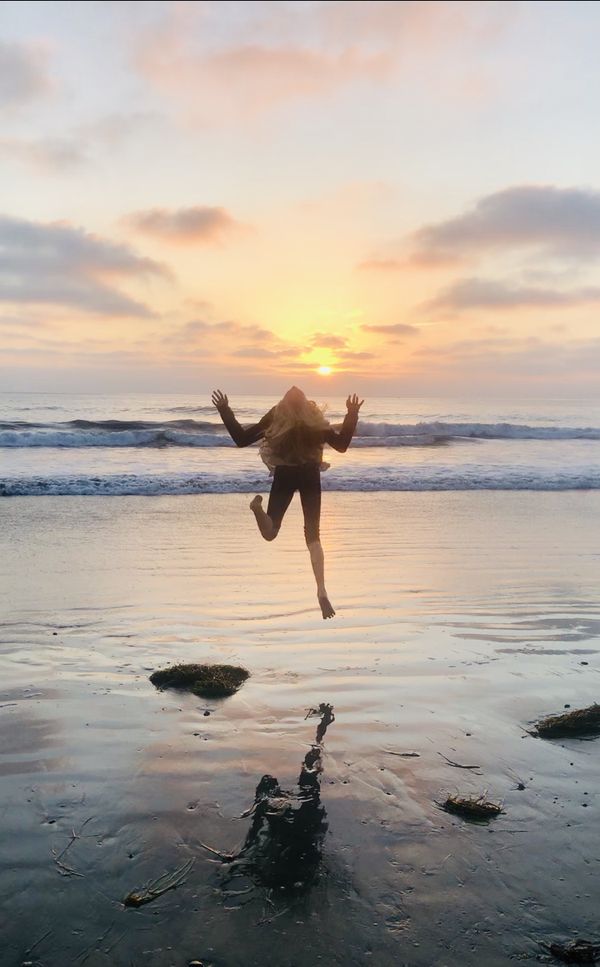 Jumping into a sunset thumbnail