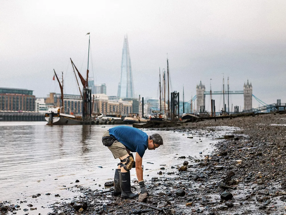 Jason Sandy mudlarking along the River Thames in London