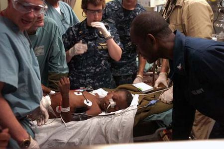 100119-N-8366W-067
ATLANTIC OCEAN (Jan. 19, 2010) Medical professionals aboard the Military Sealift Command hospital ship USNS Comfort (T-AH 20) treat a six-year-old Haitian boy in the casualty receiving room aboard the 1,000-bed hospital ship. The boy transferred to Comfort by helicopter from the aircraft carrier USS Carl Vinson (CVN 70) for treatment for an injury to his bladder and a hip fracture during an earthquake that struck Haiti on Jan 12. The boy is in the intensive care unit aboard Comfort in stable condition. Comfort is supporting Operation Unified Response, a joint operation providing humanitarian assistance to Haiti. (U.S. Navy photo by Mass Communication Specialist 3rd Class Timothy Wilson/Released)