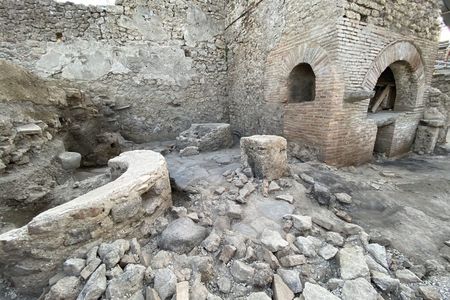 At this ancient bakery, enslaved individuals and donkeys worked under bleak conditions to grind grain.