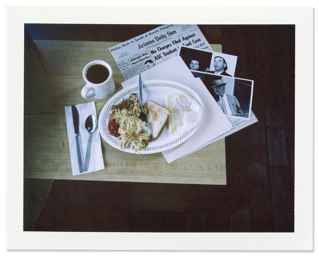 Old news stories and photographs of Billy James Hargis and Edwin Walker are laid out on a table at a Waffle House in Pelham, Alabama.