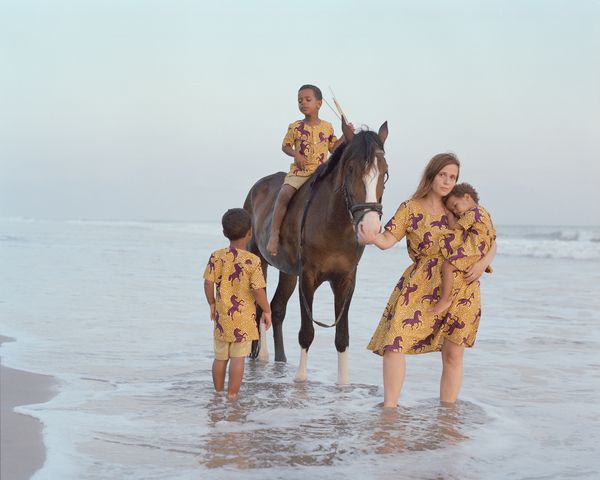 Barbora and her kids with stallion Boga at the Lake side  beach, Accra, Ghana thumbnail