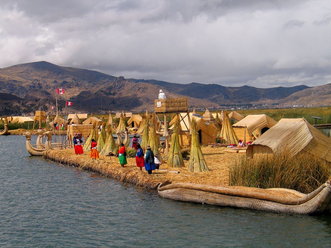 Uros women standing on a reed island on Lake Titicaca