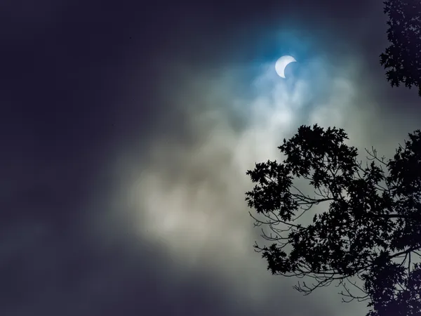 Partial Solar Eclipse Through Storm Clouds, 2023 thumbnail