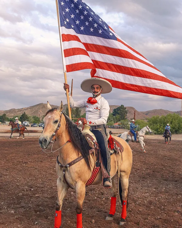 Charro raising the American flag in Truth or Consequences, NM thumbnail
