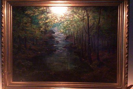An image from the eBay listing for&nbsp;Forest With a Stream, which is attributed to&nbsp;Claude Monet