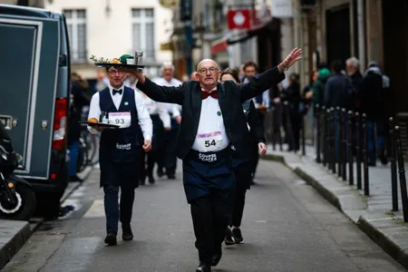 Waiters walked quickly through the streets of central Paris on Sunday while carefully balancing a tray on one hand.

