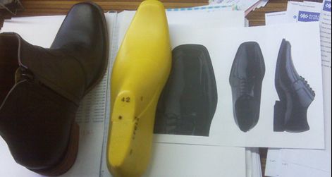 A sample elevator boot, graphic models, and the last on which it was made