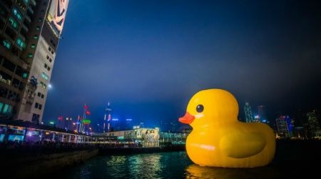 A massive inflatable rubber duck floats in Hong Kong’s Victoria Harbor, adding a flash of bright yellow to the cityscape.