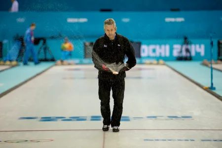 An ice maker pebbles the 2014 Olympic curling rink in Sochi.